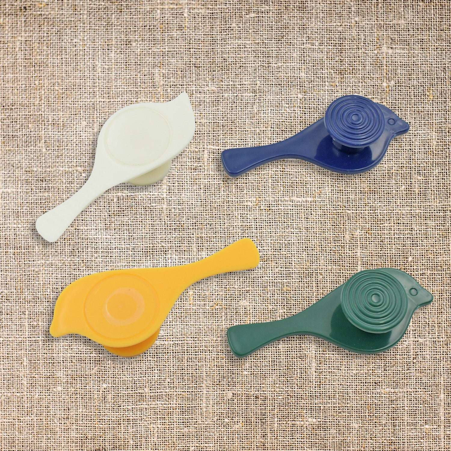 Detailed view of bird-shaped self-adhesive wall hooks